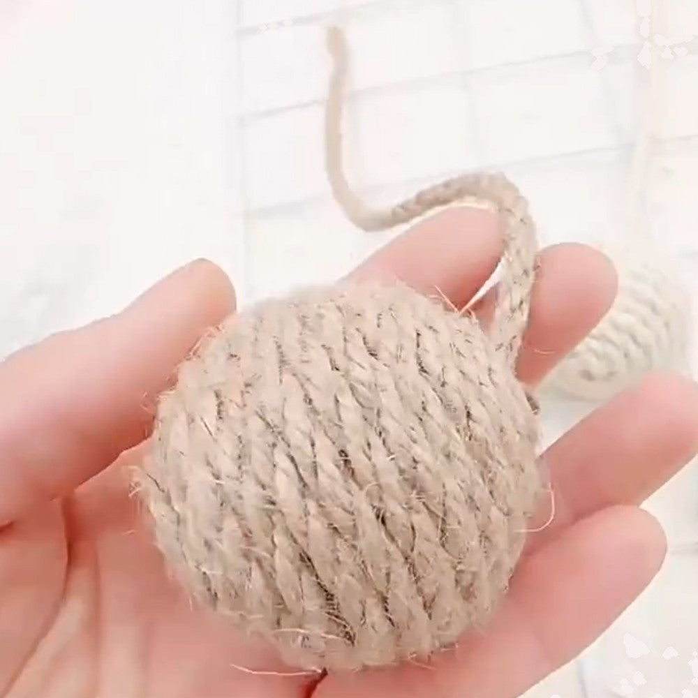 Sisal ball held in a hand to show the wound rope