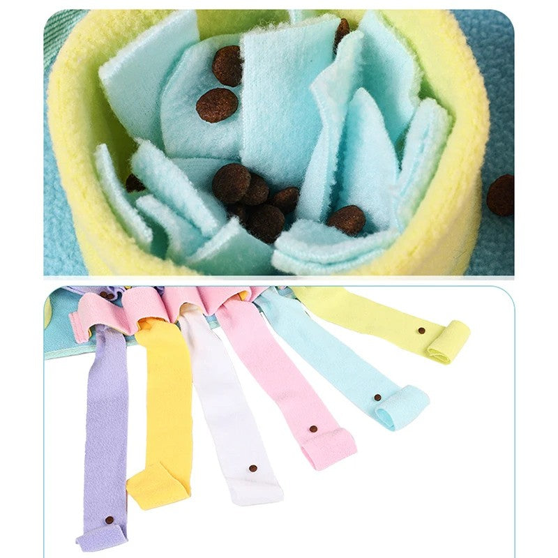 Treats hidden in the fleece folds and tentacle pockets of the snuffle mat