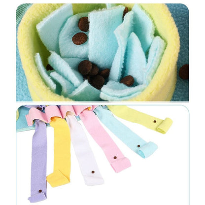 Treats hidden in the fleece folds and tentacle pockets of the snuffle mat
