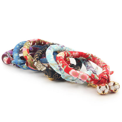 Stack of floral kimono cat collars