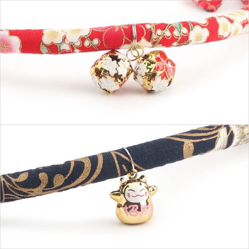 Close-up of the bell and lucky cat charm on the kimono collar