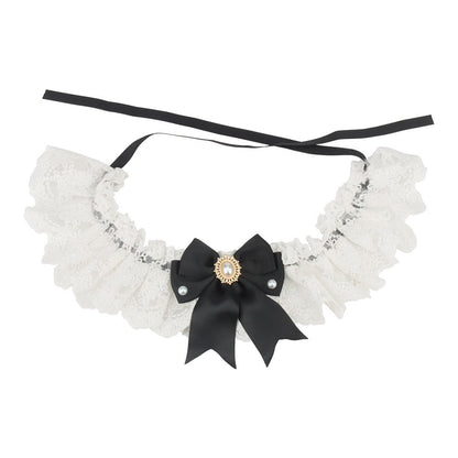Black satin bow on a white lace bow cat collar with black ribbon