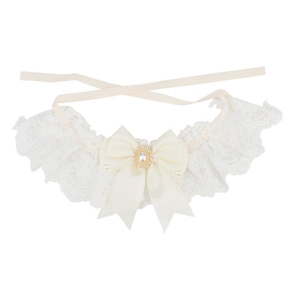 Ivory satin bow on a white lace bow cat collar with cream ribbon