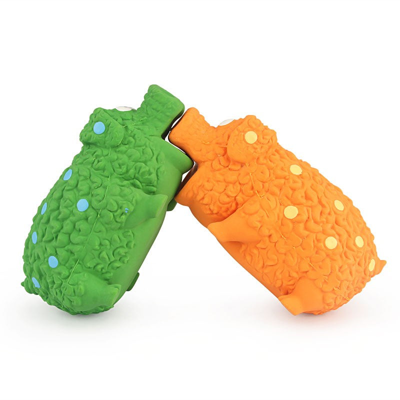 Two latex pig toys showing the squeaker hole underneath
