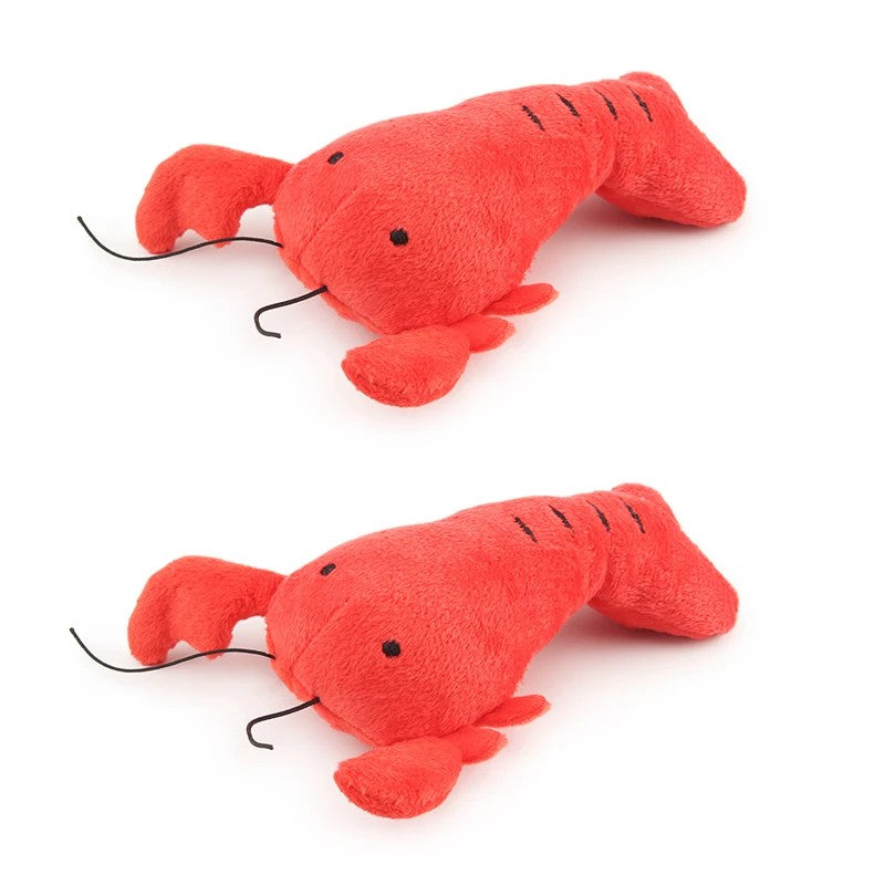 Two red lobster dog toys with antennae