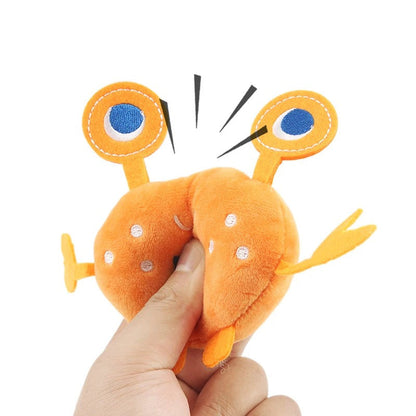 Hand squeezing the crab toy to sound the squeaker