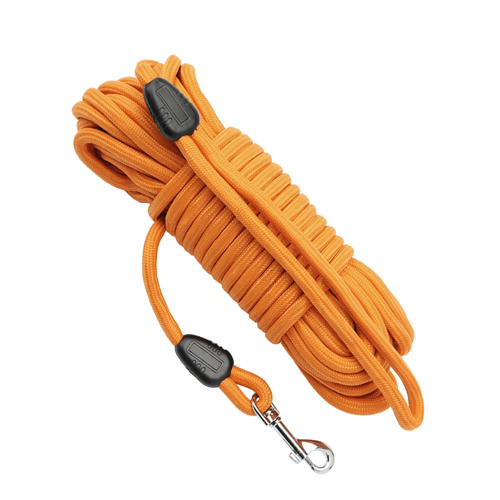 Orange long line dog leash coiled with loop handle