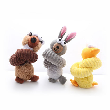 Long neck plush toys coiled up: platypus, bunny and duck