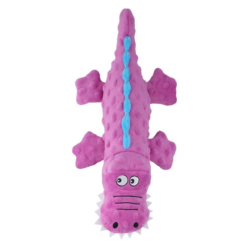 Purple crocodile dog toy with blue spikes