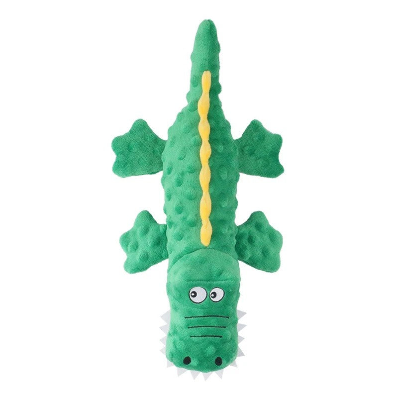 Green crocodile dog toy with pink spikes