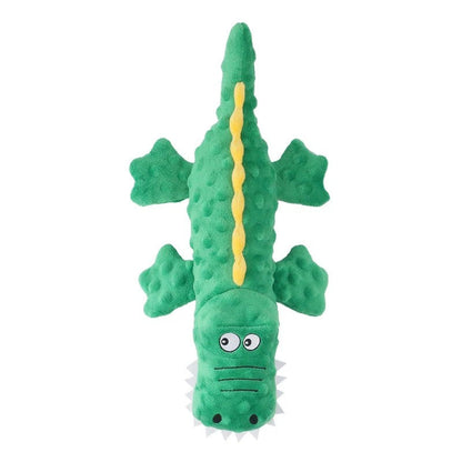 Green crocodile dog toy with pink spikes