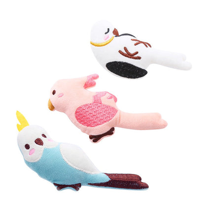 Set of three catnip bird cat toys: blue, pink and white parrots