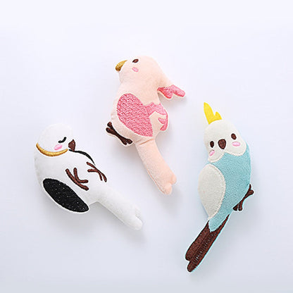 Three catnip bird cat toys laid out together