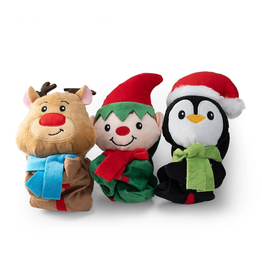 Reindeer, elf and penguin toy heads close up