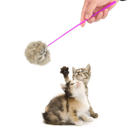 Kittens reaching for a plush ball cat teaser