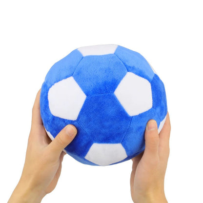 Two hands holding the large plush soccer ball toy