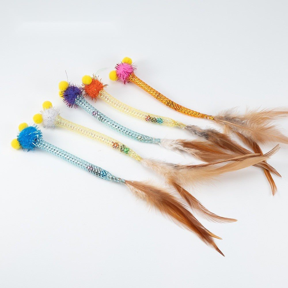 Five pom pom cat toys with glitter pom-poms and feather tails