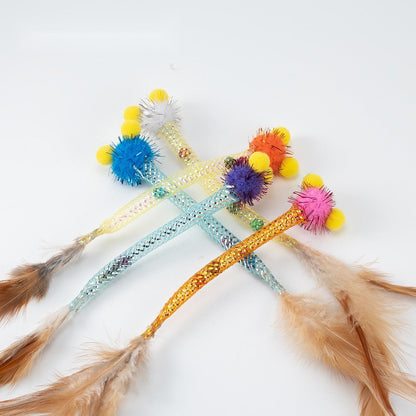 Crossed pom pom cat toys with shiny mesh tube bodies