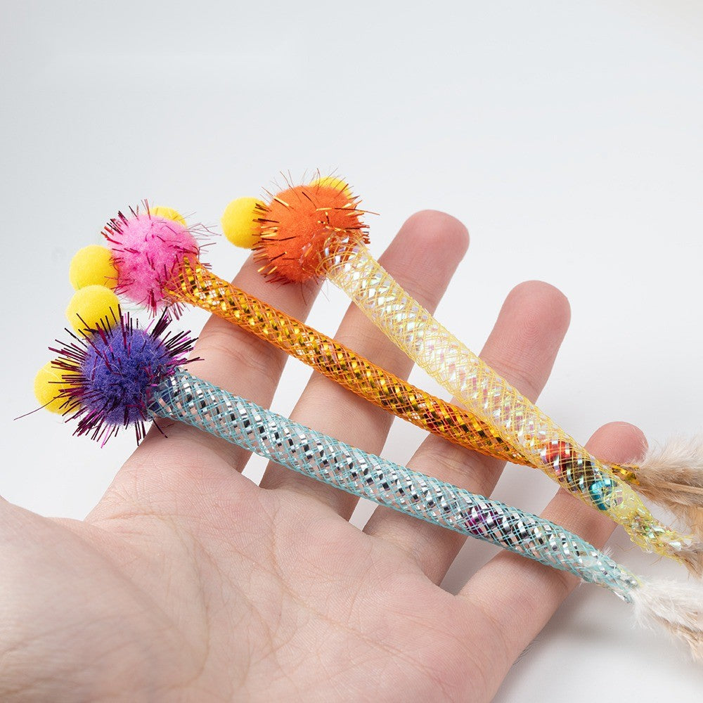 Three pom-pom toys held in a palm to show their size