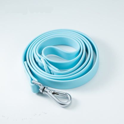 Sky blue PVC dog leash coiled in a hand-sized loop