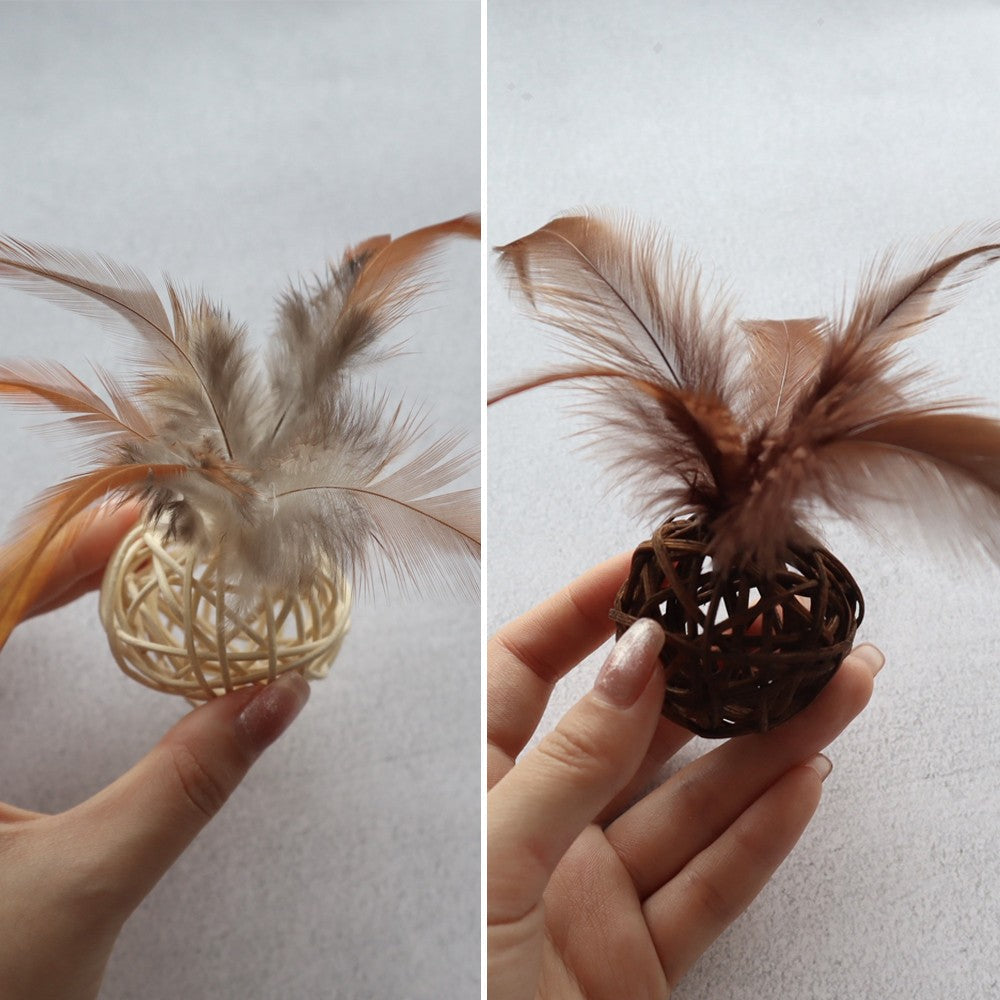 One beige and one brown rattan ball with feathers