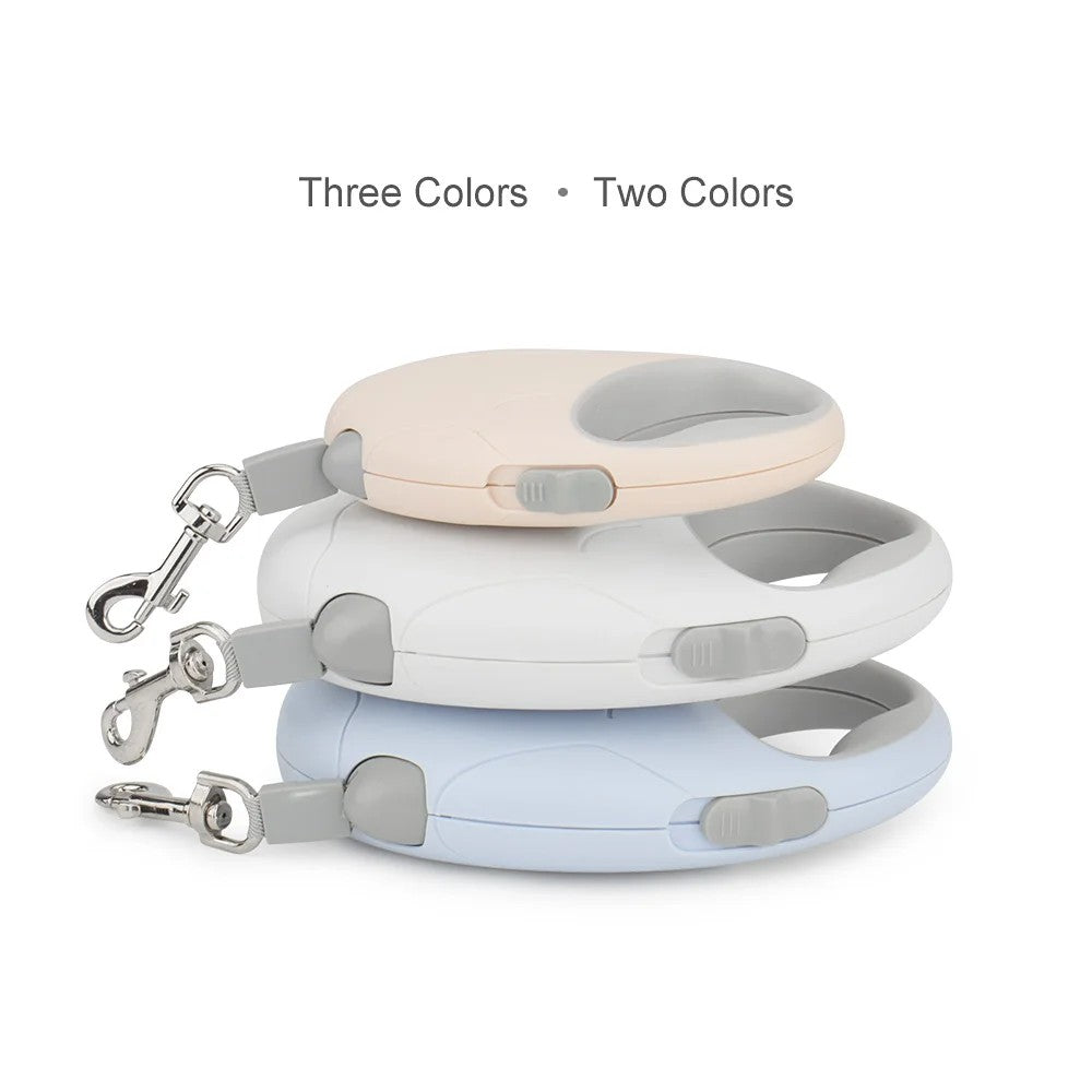 Three pastel retractable leashes stacked
