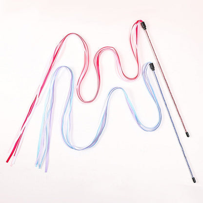 Red and blue ribbon wands for cats side by side