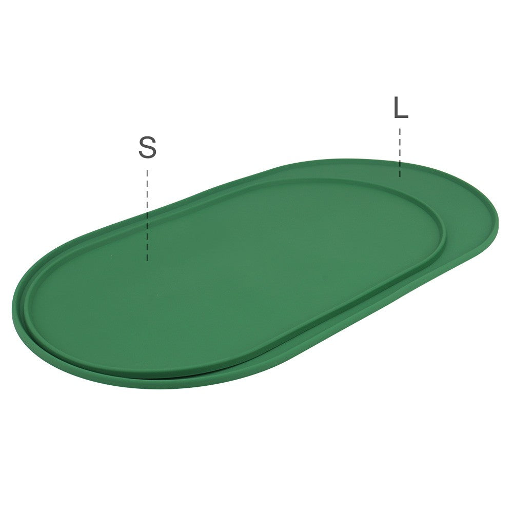 Small and large green silicone bowl mats side by side