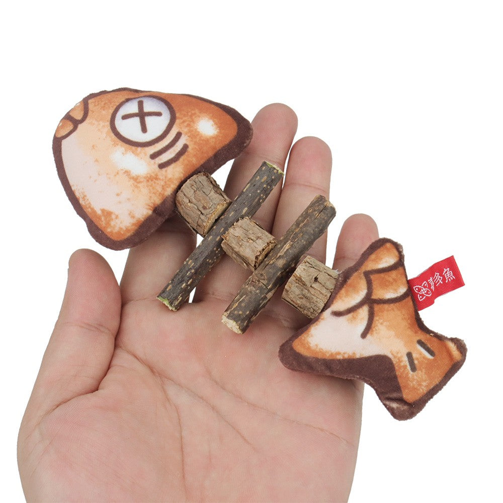 Fish bone chew toy held in a hand to show its size