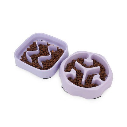 Purple square and round slow feeder bowls filled with kibble