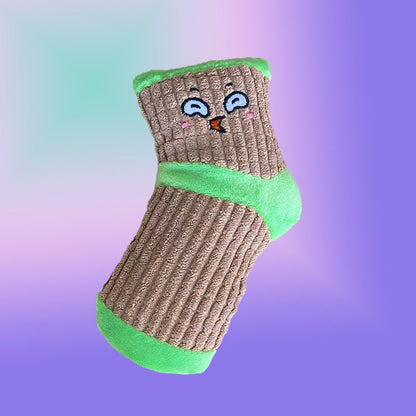 Brown corduroy sock dog toy with a green cuff and toe