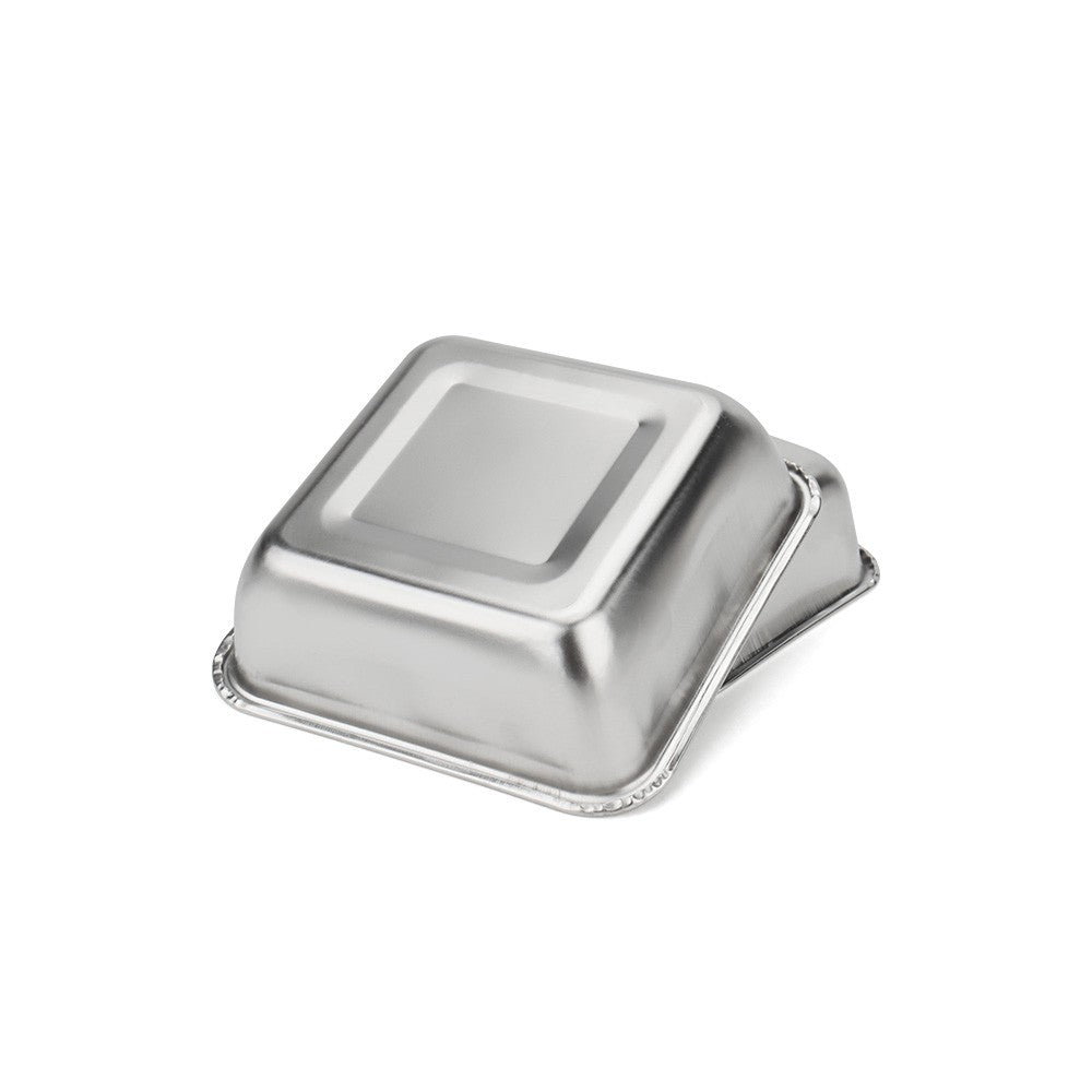 Square stainless steel cat bowl turned on its side to show the rolled rim