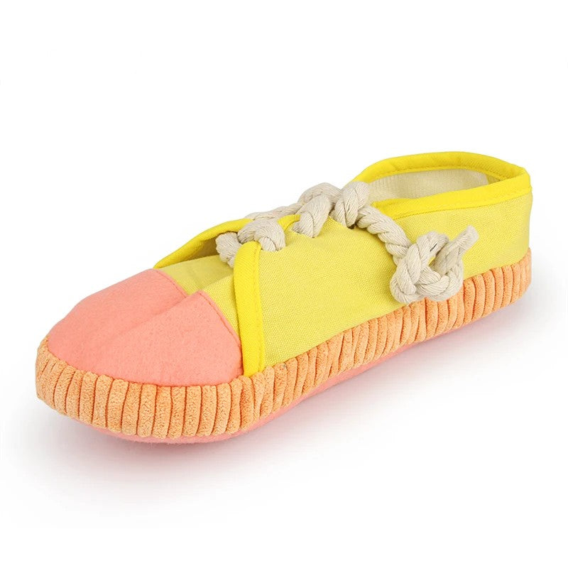 Yellow sneaker squeaky dog toy with rope laces