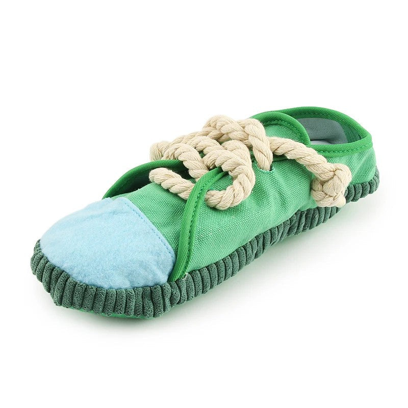 Green sneaker squeaky dog toy with rope laces