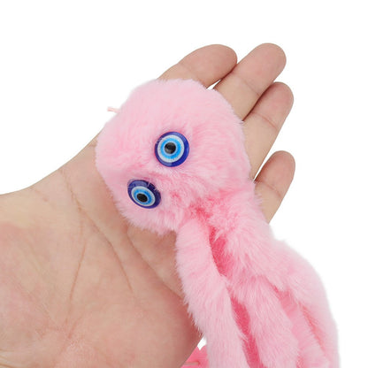 Pink octopus toy held in a hand to show the soft plush and eyes