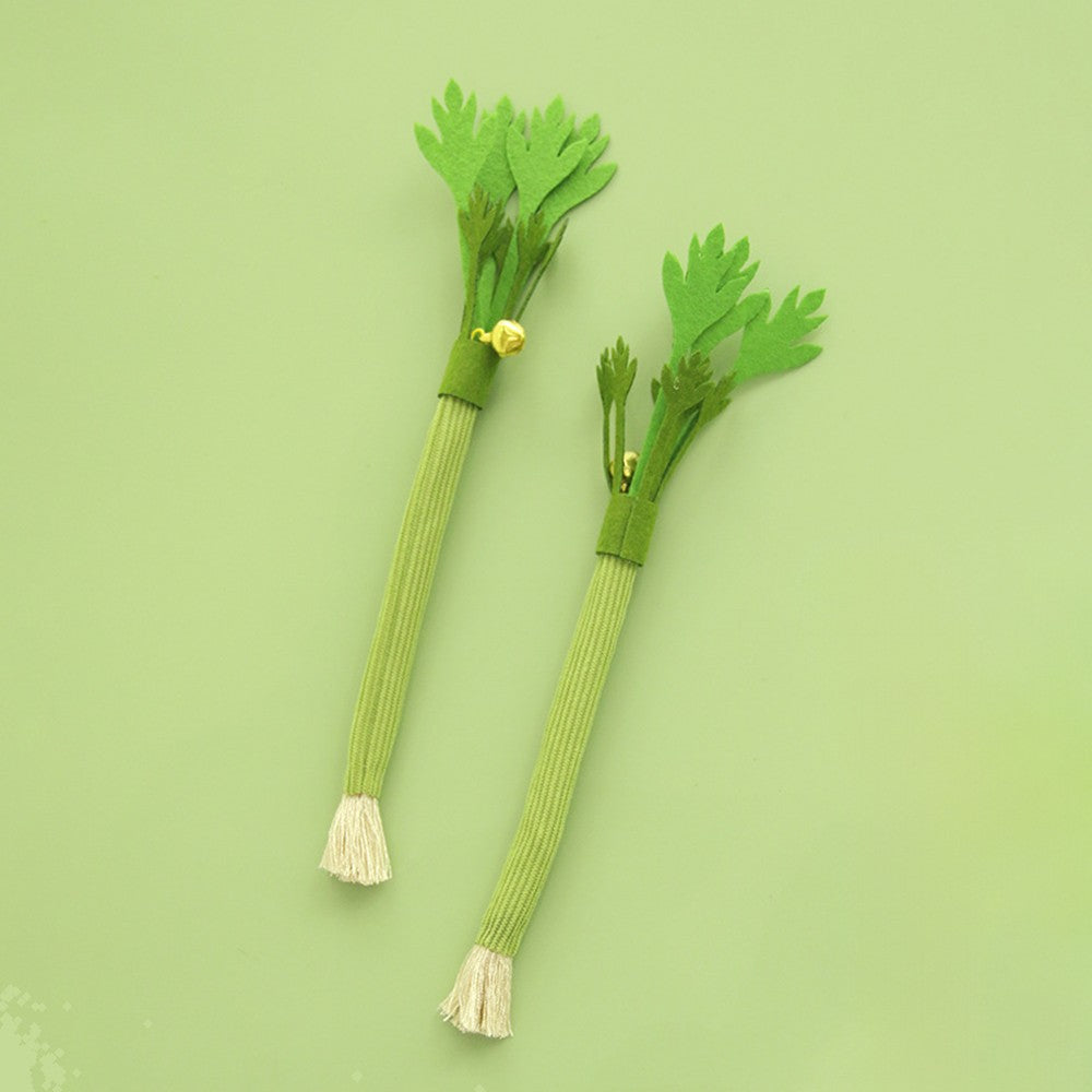 Two green celery cat chew sticks
