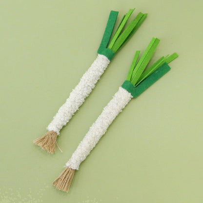 Two leek-style cat chew sticks with white wrapped stalks