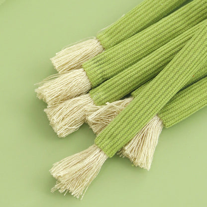 Rope tassels on the ends of the celery sticks