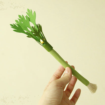 Celery cat toy held in a hand to show its 22 to 24 cm length