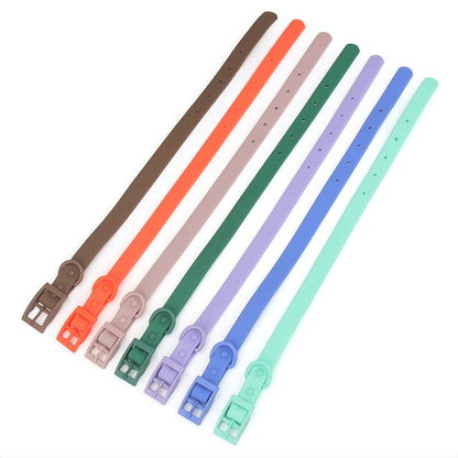 Waterproof collar straps in seven colours laid flat