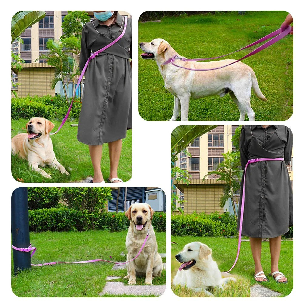 Owner wearing the hands-free leash across the body while walking a dog